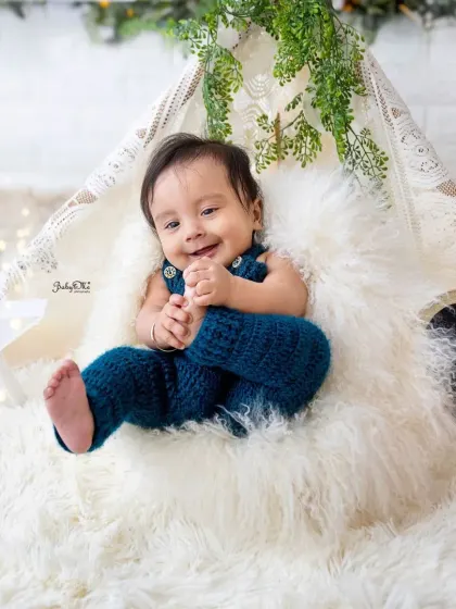 Halfway to one and full of smiles. This shot, with him grabbing his feet, perfectly captures the playful nature of a six-month-old.