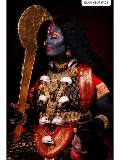 A serene yet powerful pose from the Kali Mata series, showcasing the detailed makeup and styling from a different angle.