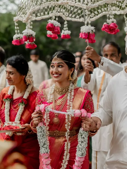 The bride's joyful entrance, a beautiful moment filled with anticipation and happiness. We capture the emotion as she walks towards her new beginning.