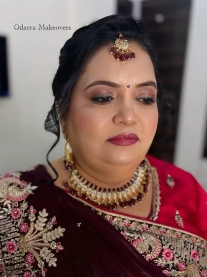A close-up of the wedding day makeup for the bride's mother. The look is traditional, with a focus on her eyes and a beautiful bindi.