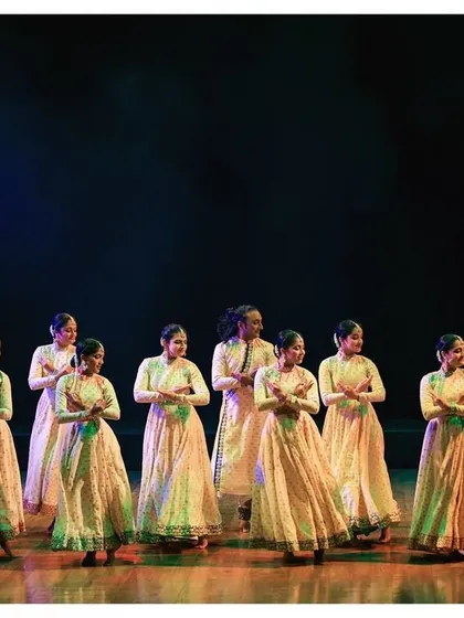 The enchanting tale of Kathak is told through every movement. This is a beautiful shot of our dancers in perfect unison, their forms creating a visual symphony on stage.