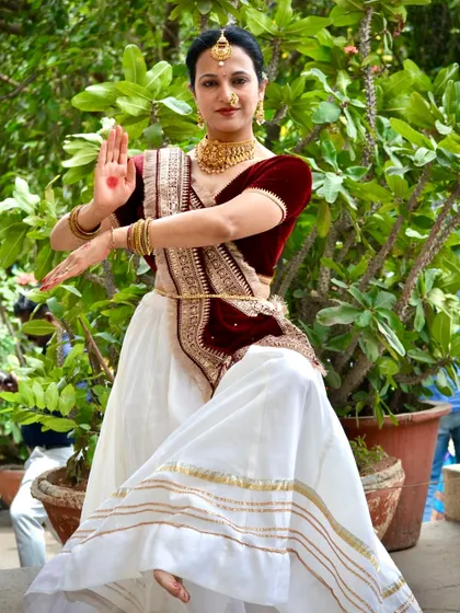 A powerful stance from a traditional dance photoshoot. I am not just a fitness instructor; I am a trained dancer with a passion for expressive movement.