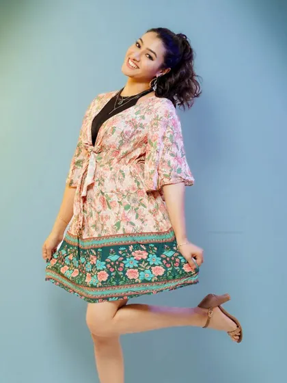 A playful and happy pose. This full-length shot captures a sense of fun and is great for lifestyle or youth-focused branding.