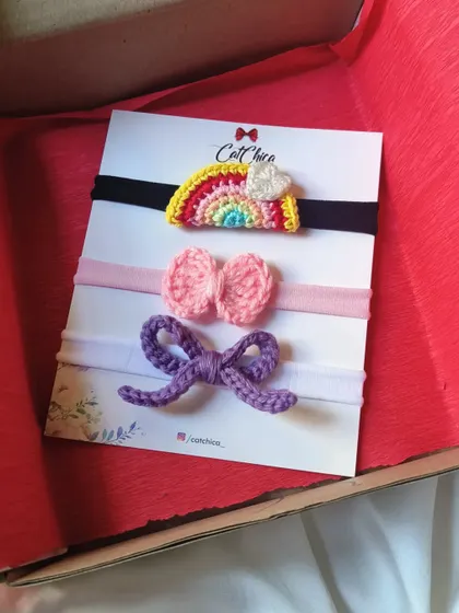Our handmade crochet newborn baby headbands are perfect for gifting. This set of three is packaged in a gift box.