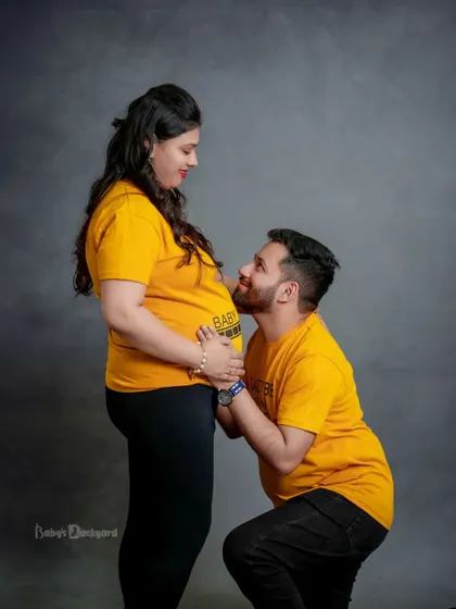 A dad-to-be shares a sweet moment with his baby on the way. These simple, heartfelt poses in our studio create some of the most cherished memories.