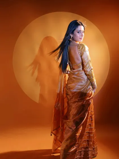 Another shot from the NDTV Marathi shoot with Isha Malviya. The backless blouse and flowing saree were complemented by sleek, straight hair and makeup that highlighted her features from every angle.
