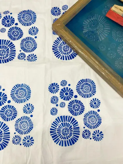 The screen and the resulting printed fabric, showing how the design is transferred cleanly and effectively.