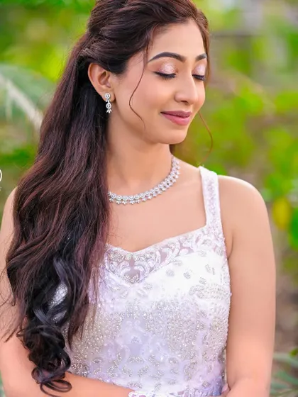 A close-up of this beautiful white gown shows the delicate beading on the bodice. It's a perfect choice for a classic and elegant church wedding or pre-wedding shoot.