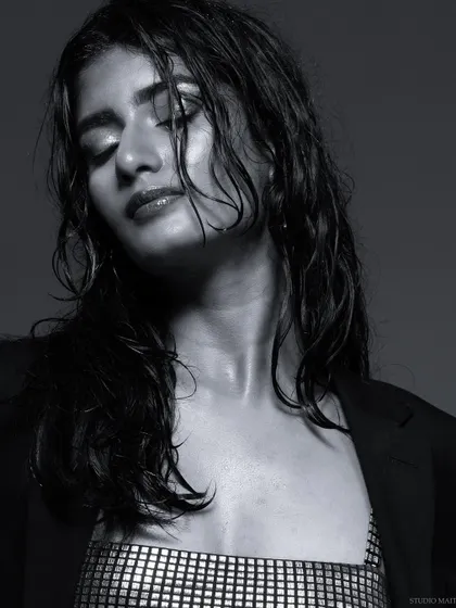 A black and white shot with eyes closed, creating a serene and artistic mood.