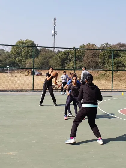 Mastering the fundamentals is crucial. This photo shows our female players practicing their triple threat stance, a foundational position that gives them the option to shoot, pass, or dribble effectively.