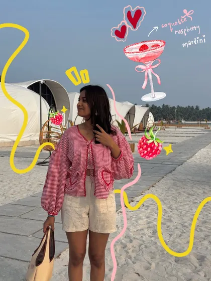 This photo gets a full themed treatment, with doodles of a raspberry martini and strawberries to match the coquette aesthetic.