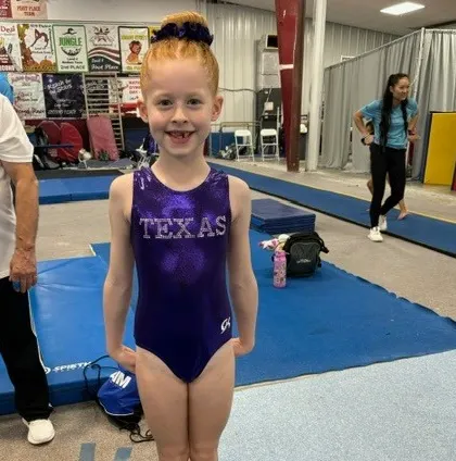 A proud Level 3 gymnast after competing at the South State Championships.