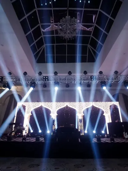 Setting the stage for an epic party. This shot of the sangeet stage with dramatic lighting shows my eye for capturing the ambiance and scale of your event.