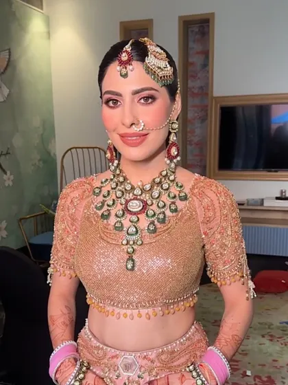 The bride looking radiant, her hair and makeup perfectly done for her special day.