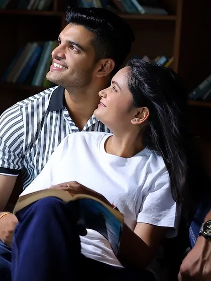 The library set provides a warm and intimate atmosphere for this couple's pre-wedding photoshoot.