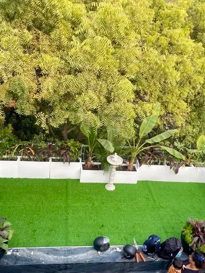 Garden making is about considering the sun's position. This rooftop garden area uses artificial turf and shade tolerant plants, as the northeastern side gets very little direct sunlight in winter.