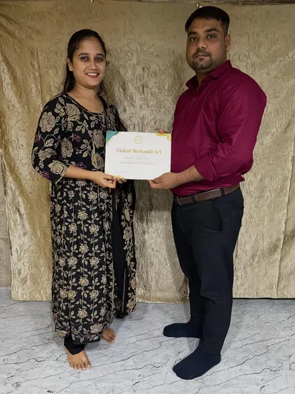 A happy student with her certificate. My goal is to empower each student with the skills to build a career in mehandi art.
