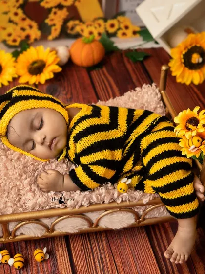 A sleeping bumblebee in a field of sunflowers. Even older babies sometimes drift off during a session, creating peaceful moments like this.