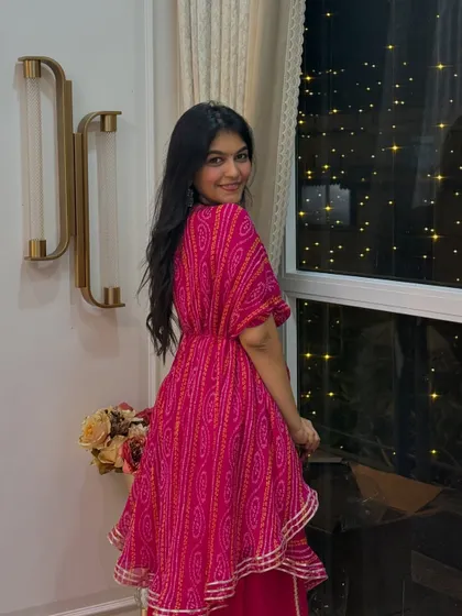 Another look at my Diwali sharara set. The asymmetrical top and belted waist add a modern twist to the traditional bandhani print.