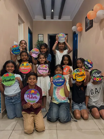 A room full of creativity. These kids are showing off the floral nameplates they designed at a home birthday party. I can set up my workshops anywhere, turning your space into an art studio.