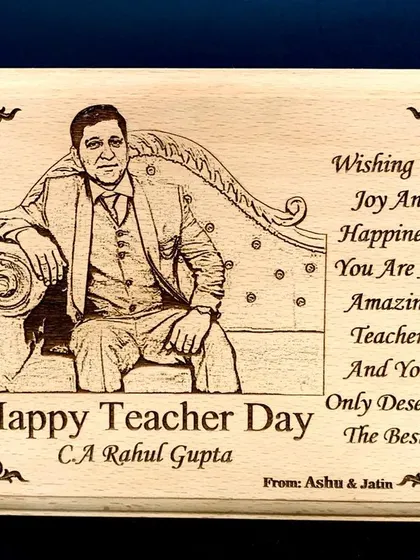 A classic gift for a respected teacher. This wooden plank is engraved with their photo and a 'Happy Teacher Day' message.