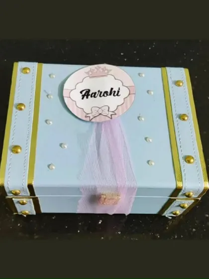 A personalized trunk for a sister named Aarohi. The custom name tag with a little crown adds a royal touch to this thoughtful gift.