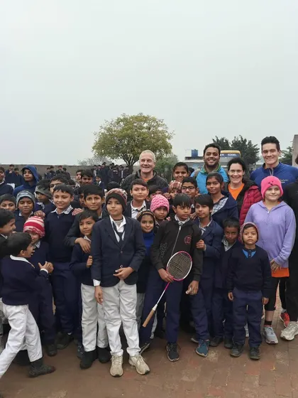 An impromptu stop at a village school during our Delhi-Agra ride. The local children were as curious about our guests as they were about them, leading to this wonderful group photo.