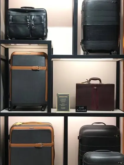 A custom shelving unit designed specifically for luggage and briefcases, ensuring each item is presented clearly.