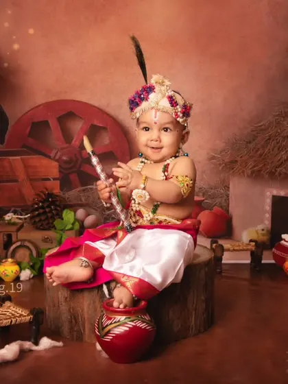 This little Krishna is all smiles, holding his flute and ready to create some music and mischief.