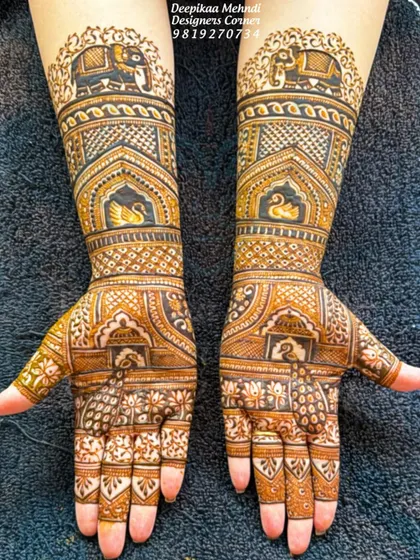 A clean and clear photo of a traditional bridal design. The pattern features majestic elephants on the forearms and graceful swans on the palms, all tied together with intricate geometric work.