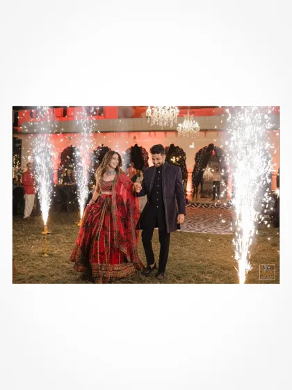 The couple makes a grand entrance with sparklers at their Sangeet night in Jaipur.