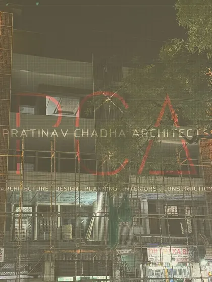 The facade of the Outram Lines luxury residence, seen at night while still under construction. The image shows the terracotta jaalis illuminated, giving a preview of the final design.