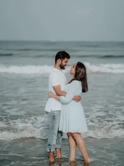 A romantic embrace in the gentle waves of the sea. This kind of shot captures the intimacy and connection between a couple.