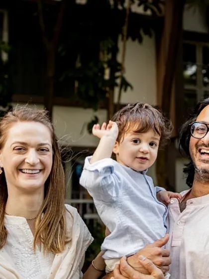 This is what a relaxed, happy family portrait looks like. We were just chatting and laughing in the garden, and I captured this beautiful, candid moment. It shows their connection without any formal posing.