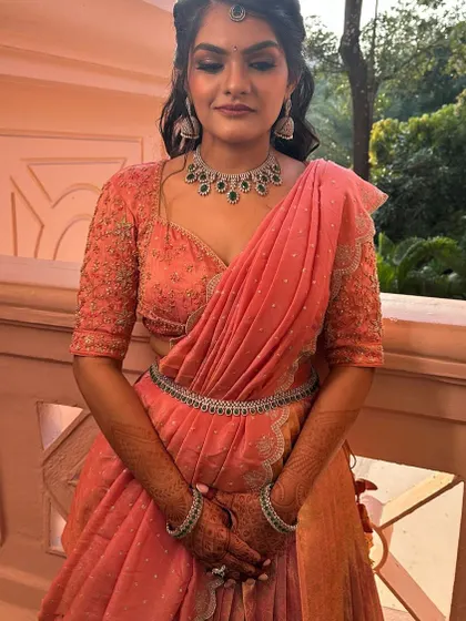 Another beautiful shot of our client in her custom peach langa davani. The fit and fall of the outfit are designed to be both comfortable and flattering.