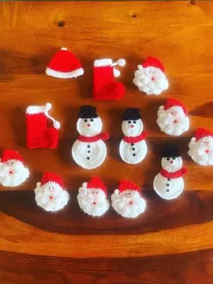 A collection of my cool Christmas brooches, including Santas, snowmen, and stockings. Pin them on your sweater to highlight your outfit.