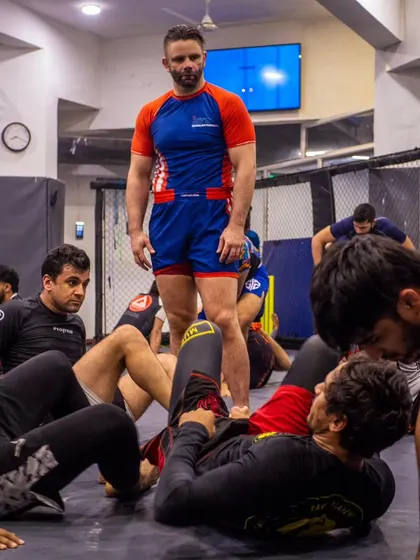A wide shot of our BJJ seminar, with students and coaches alike absorbing knowledge from a world-class practitioner. The learning never stops at Warrior's Cove.