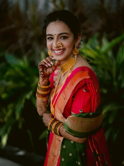 A joyful, candid portrait of the bride, Zaee, during her engagement ceremony.