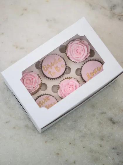 Here is the full "Bride to Be" cupcake set, packaged in a window box that makes for a beautiful gift presentation. These custom cupcake boxes are perfect for gifting at bachelorette parties or as a treat for the bride.