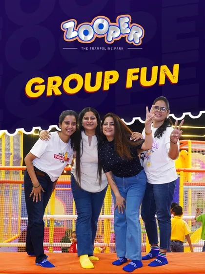 Group fun is what I do best. Here, teachers from a school trip take a moment to pose and enjoy the vibrant atmosphere.
