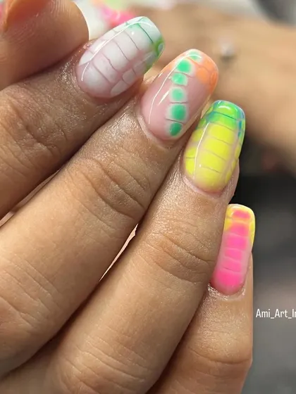 A closer look at the vibrant colors and patterns of this Holi-inspired nail art set.