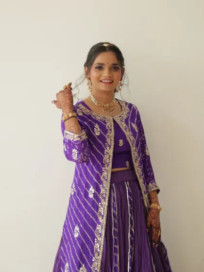 Another beautiful shot of this guest look. The purple outfit is so vibrant and festive.