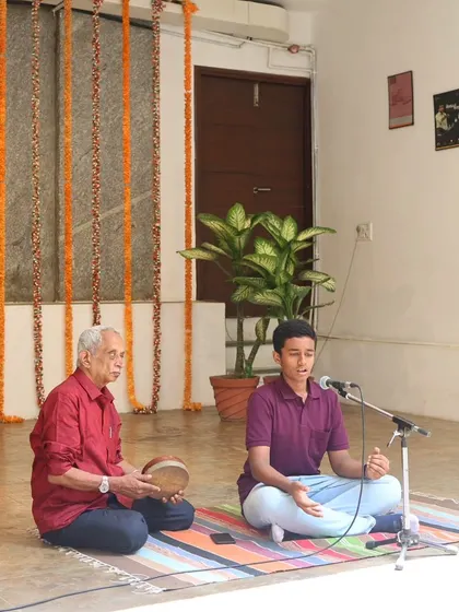 A young vocalist performs with his guru during the "Platform Performances" showcase, embodying the Guru-Shishya tradition.