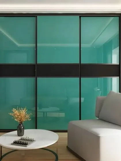 Similar to the previous design, this sliding wardrobe features calming sea-green lacquered glass panels. We offer a wide range of colors to match your personal style.