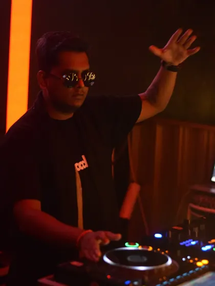 In the zone at Tipsy Bro. A focused shot of me mixing tracks during a busy club night.
