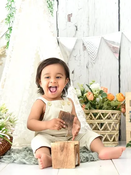 A cheeky tongue-out moment in a rustic tent setup. It's these spontaneous, fun expressions that I love to capture.