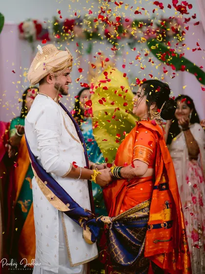 The moment the Antarpat drops, and the couple is showered with petals.