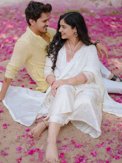 Sitting amongst fallen bougainvillea, this shot is a celebration of romance in full bloom. We love finding unique, colorful settings for our couple shoots.