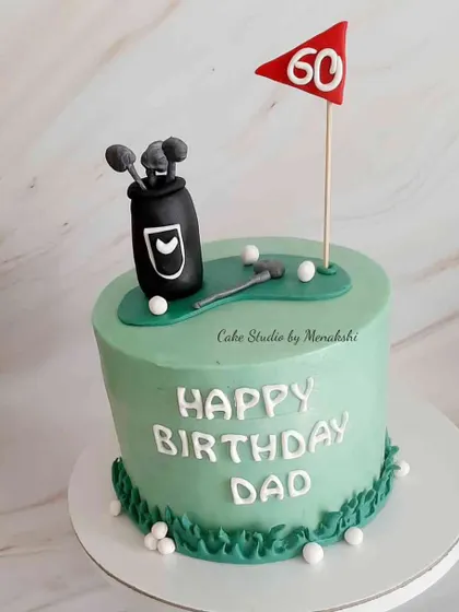 A 60th birthday cake for a golf-loving dad. This design features a green, a flag, and a bag of clubs, perfect for a par-tee.