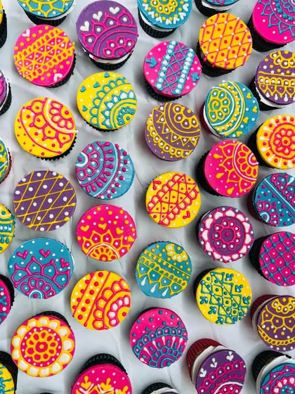 Holi Hai! These are my special Holi-themed cupcakes with vibrant, hand-piped henna-style designs. They are as colorful as the festival itself.